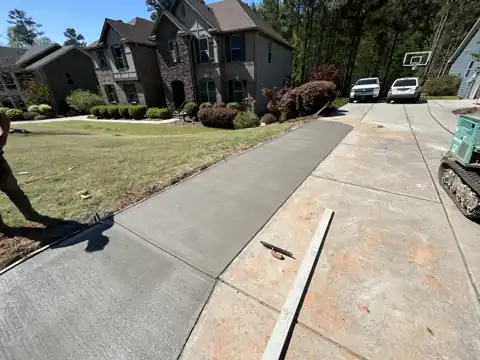 Long two-lane uphill concrete driveway