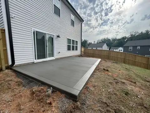 Charcoal broom-finish patio with steps