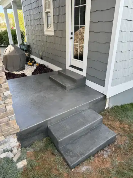 Decorative smooth-finish charcoal patio and stairs