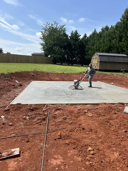 Power troweling a fresh concrete slab