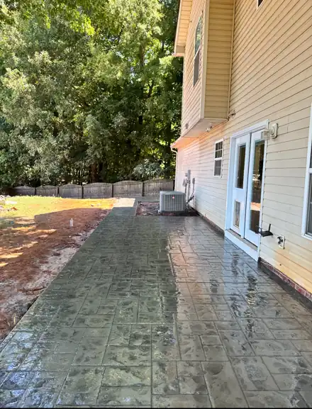 Freshly sealed stamped concrete patio