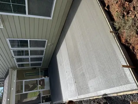 Backyard concrete patio, broom finish